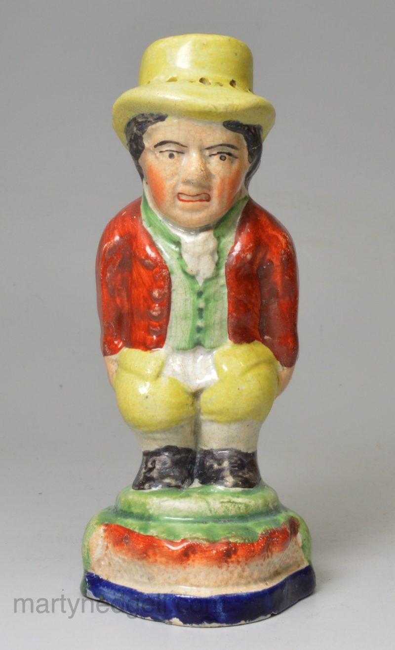 Staffordshire pottery pepper pot modelled as Roger Giles, circa 1820, probably Sherratt pottery