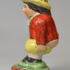 Staffordshire pottery pepper pot modelled as Roger Giles, circa 1820, probably Sherratt pottery