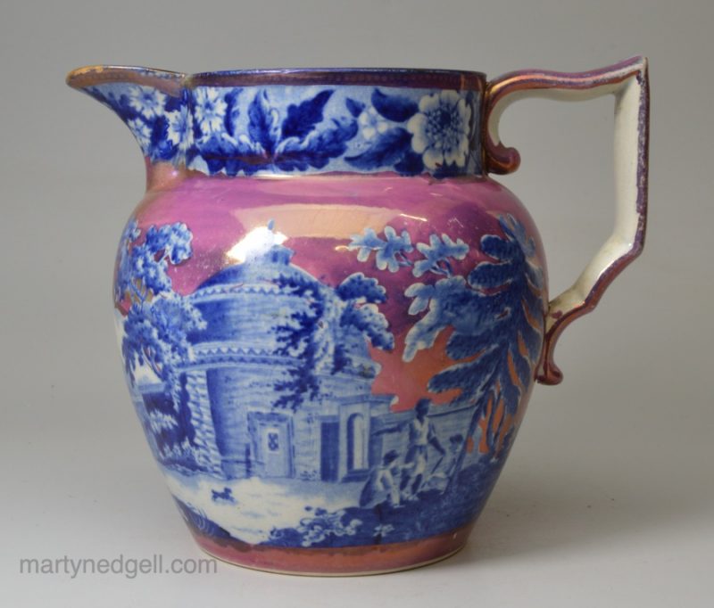 Pearlware pottery jug decorated with blue transfer prints under the glaze and pink lustre over the glaze, circa 1820