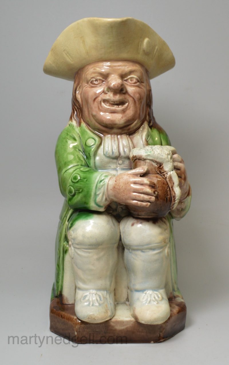 Creamware pottery Toby jug decorated with coloured glazes, circa 1790, probably Wood family