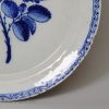 London delft charger painted in blue with a rose, circa 1760