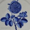 London delft charger painted in blue with a rose, circa 1760