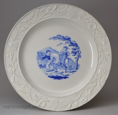 Pearlware pottery child's plate decorated with a blue transfer print under the glaze, circa 1720