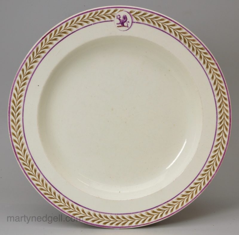 Wedgwood creamware pottery plate with a family crest, circa 1820