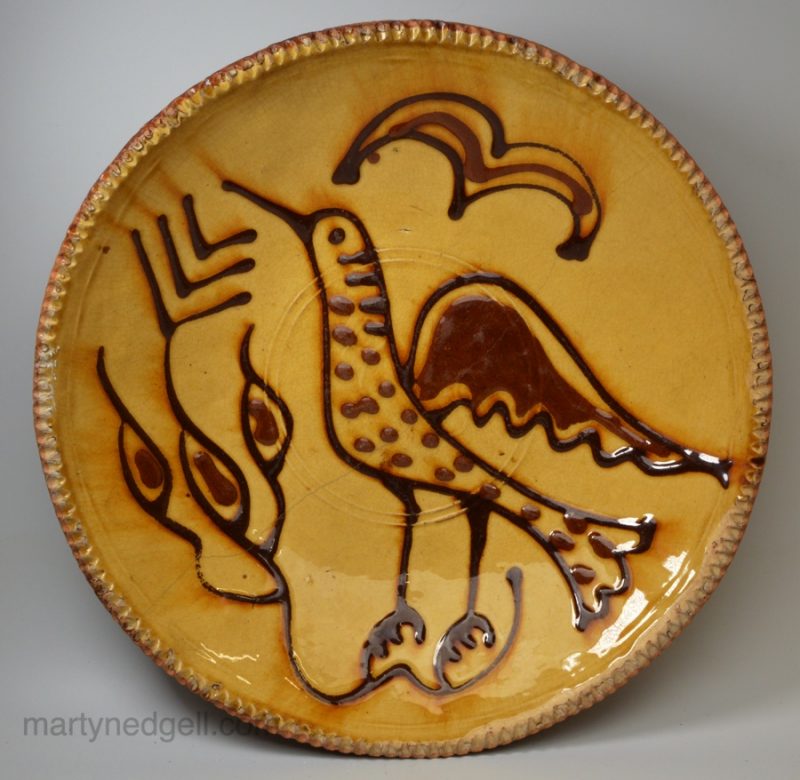 Staffordshire slipware dish trail decorated with a bird, circa 1740