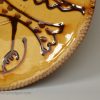 Staffordshire slipware dish trail decorated with a bird, circa 1740