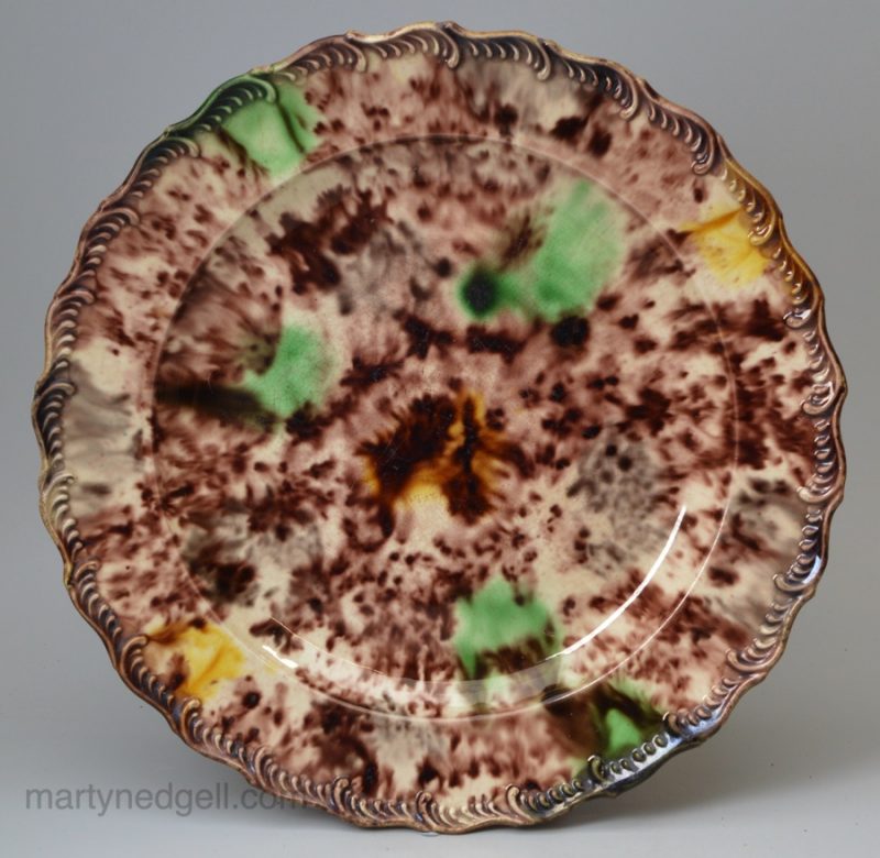 Creamware feature edge plate decorated with Whieldon type glazes, circa 1770