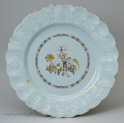 Bristol delft polychrome plate decorated with a bianco sopra bianco border, circa 1750