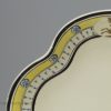 Creamware pottery dessert dish decorated with a family crest, circa 1800, one of two