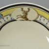 Creamware pottery dessert dish decorated with a family crest, circa 1800, one of two