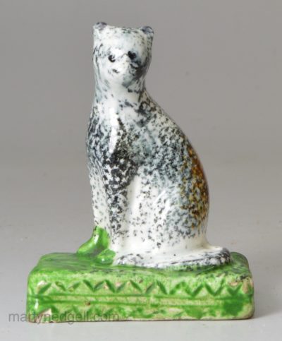 Small pearlware pottery Yorkshire type cat, circa 1820