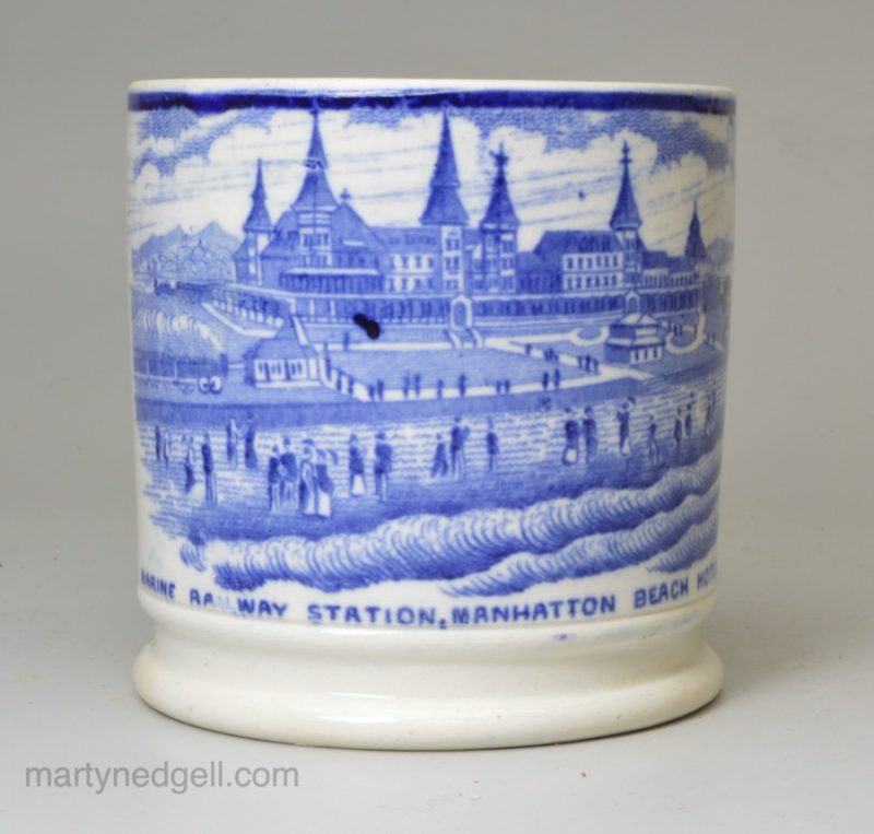 Small pearlware pottery mug transfer printed in blue with a view of Marine Railway Station, Manhattan Beach Hotel, circa 1880