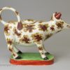 Pearlware pottery cow creamer decorated with overglaze enamels, circa 1820