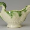 Creamware pottery dolphin sauce boat decorated with green under the glaze, circa 1780