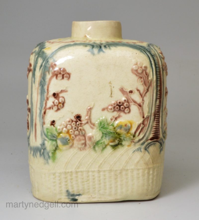 Creamware pottery tea canister decorated with moulding and colours under the glaze, circa 1770, William Greatbatch Pottery