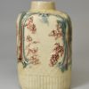 Creamware pottery tea canister decorated with moulding and colours under the glaze, circa 1770, William Greatbatch Pottery