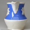 Small pearlware jug decorated with blue slip and sprigs, circa 1830