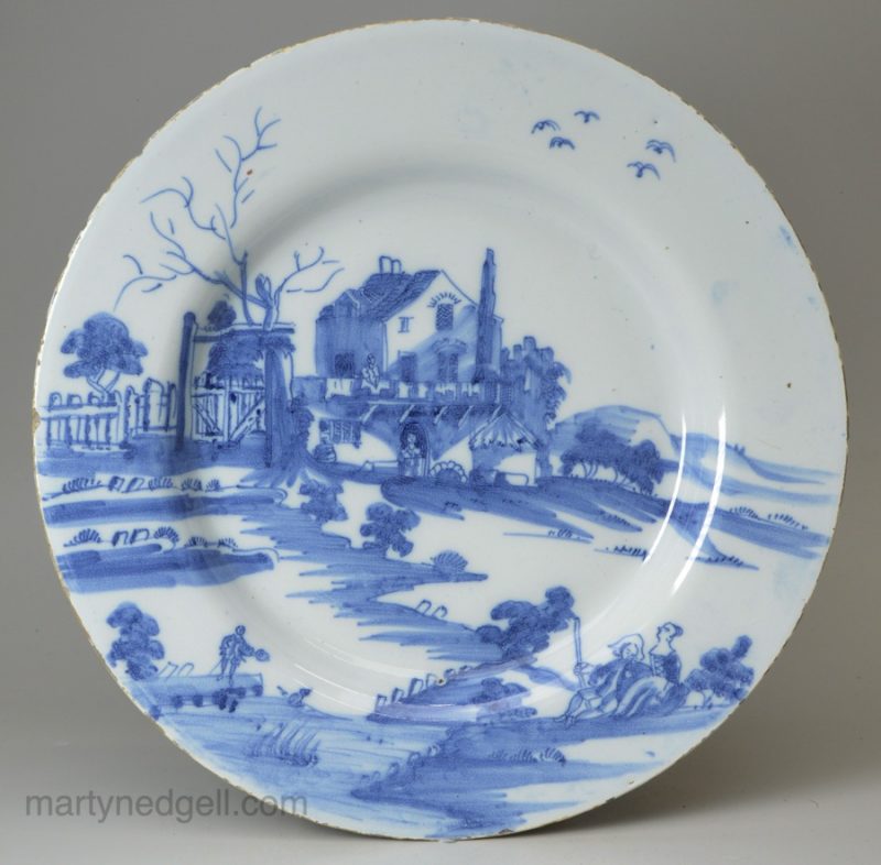 Liverpool delft plate, circa 1750 painted with figures in a rural landscape