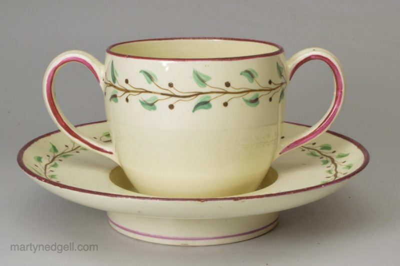 Wedgwood creamware pottery two handled cup and saucer, circa 1790