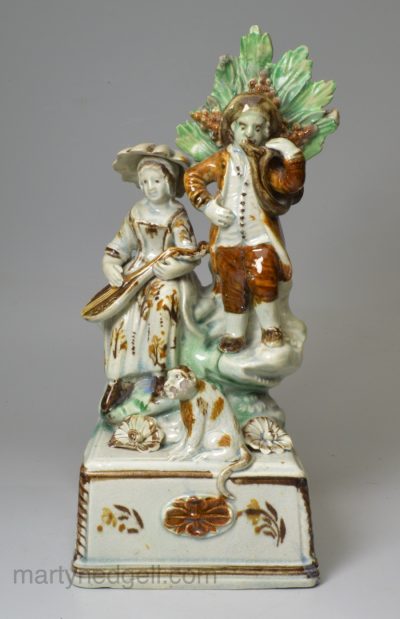 Staffordshire pearlware pottery figure of musicians decorated with colours under the glaze, circa 1790