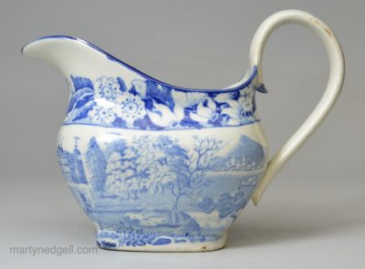 Pearlware pottery cream jug decorated with a blue transfer print under the glaze, circa 1820