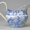 Pearlware pottery cream jug decorated with a blue transfer print under the glaze, circa 1820