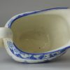 Pearlware pottery cream jug decorated with a blue transfer print under the glaze, circa 1820