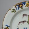 London delft polychrome plate with a daffodil border, circa 1750