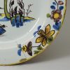 London delft polychrome plate with a daffodil border, circa 1750