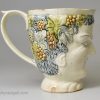 Creamware pottery Bacchus mug decorated with colours under the glaze, circa 1780