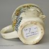 Creamware pottery Bacchus mug decorated with colours under the glaze, circa 1780