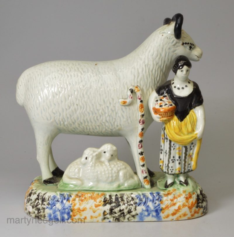 Yorkshire type prattware pottery large sheep, lambs and an attendant, circa 1820