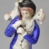 Staffordshire pearlware pottery figure decorated with overglaze enamels, 'Lost Sheep Found', circa 1820