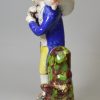 Staffordshire pearlware pottery figure decorated with overglaze enamels, 'Lost Sheep Found', circa 1820