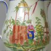 Large pearlware jug decorated with musicians at play with enamels over the glaze, circa 1800