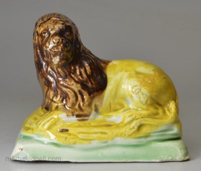 Pearlware pottery lion decorated with colours under the glaze, circa 1800