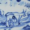 London delft tile painted in blue with a cow being milked, circa 1740