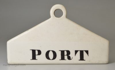 Glazed white terracotta 'PORT' bin label, circa 1840