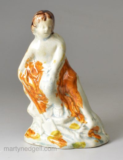 Small prattware pottery figure of a boy with a spade, circa 1790