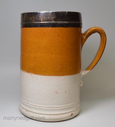 Fulham half gallon tankard with brown and white slip, lead glaze, over a stoneware body, circa 1720-50