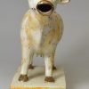 Pearlware pottery cow creamer decorated with colours under the glaze, circa 1820