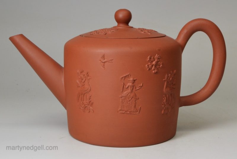 Staffordshire red stoneware teapot decorated with sprigs of a farmer and his wife, circa 1770