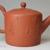 Staffordshire red stoneware teapot decorated with sprigs of a farmer and his wife, circa 1770