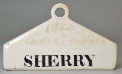 Glazed white terracotta 'SHERRY' bin label, circa 1840