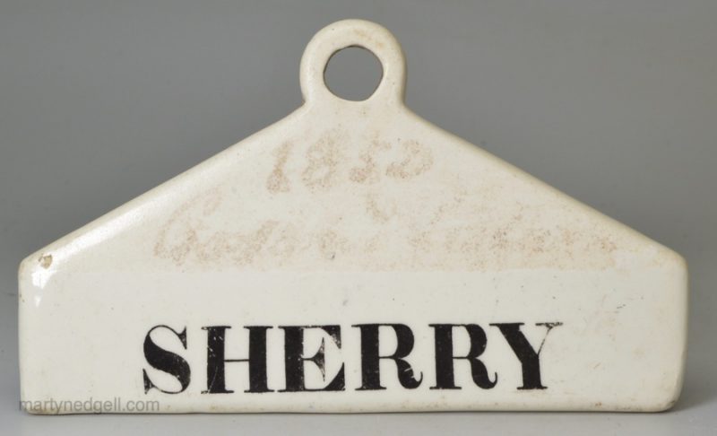 Glazed white terracotta 'SHERRY' bin label, circa 1840