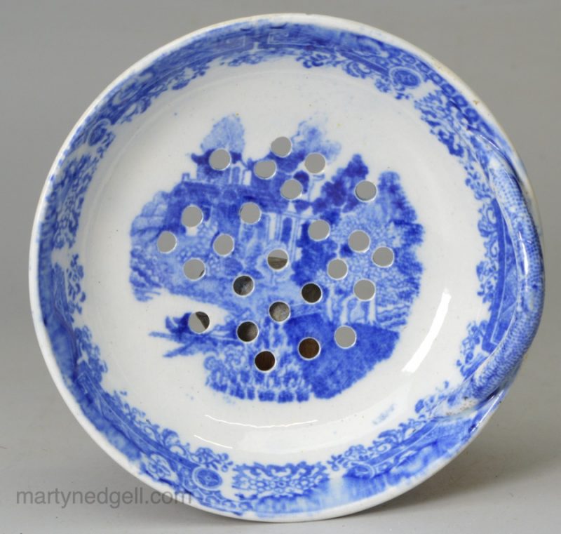 Pearlware pottery strainer decorated with a blue transfer print under the glaze, circa 1820