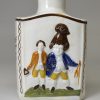 Prattware pottery tea canister moulded with Macaroni figures, circa 1820