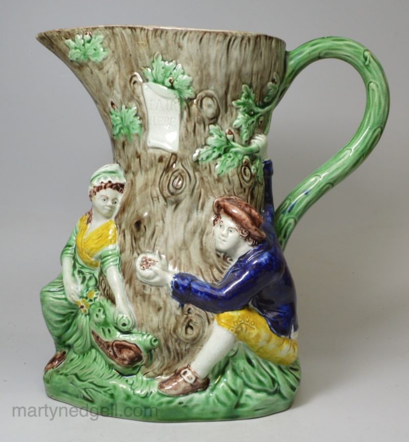 Pearlware pottery fair Hebe jug decorated with colours under the glaze, circa 1795, probably Wood family