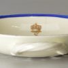 Creamware pottery strainer with a family crest, circa 1790