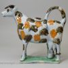 Prattware pottery hobbled cow creamer, circa 1820